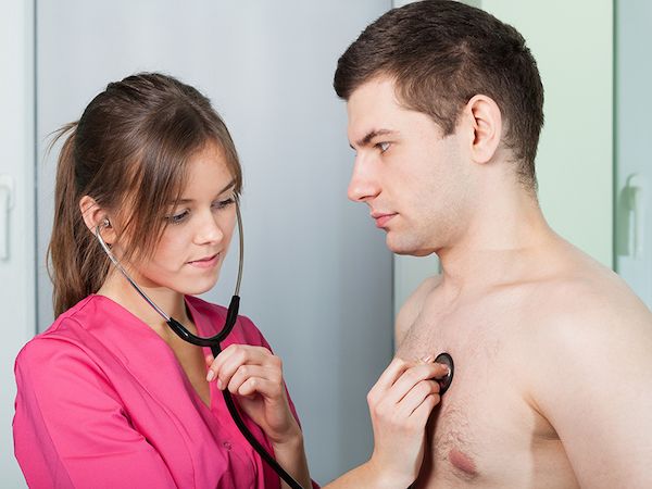 doctor model listening to a patient models chest